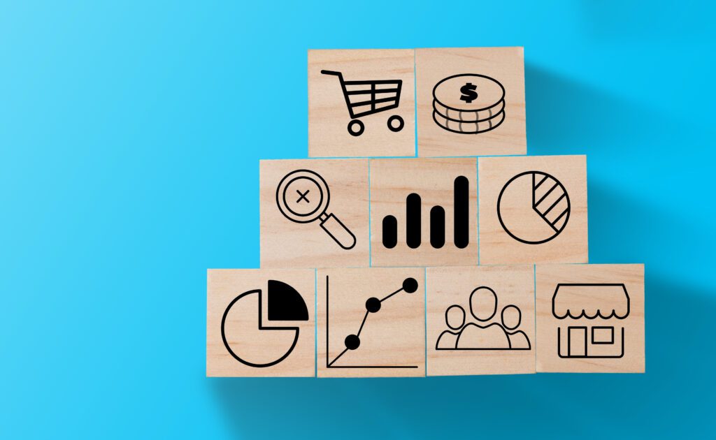 hand putting target icon print screen wooden cube stack other investment icon such as graph dollar coin trolley cart business investment concept